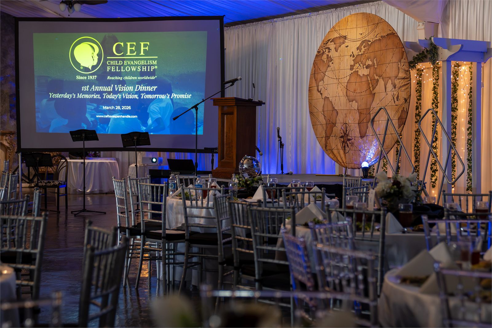 The CEF Vision Dinner stage with the CEF logo on screen