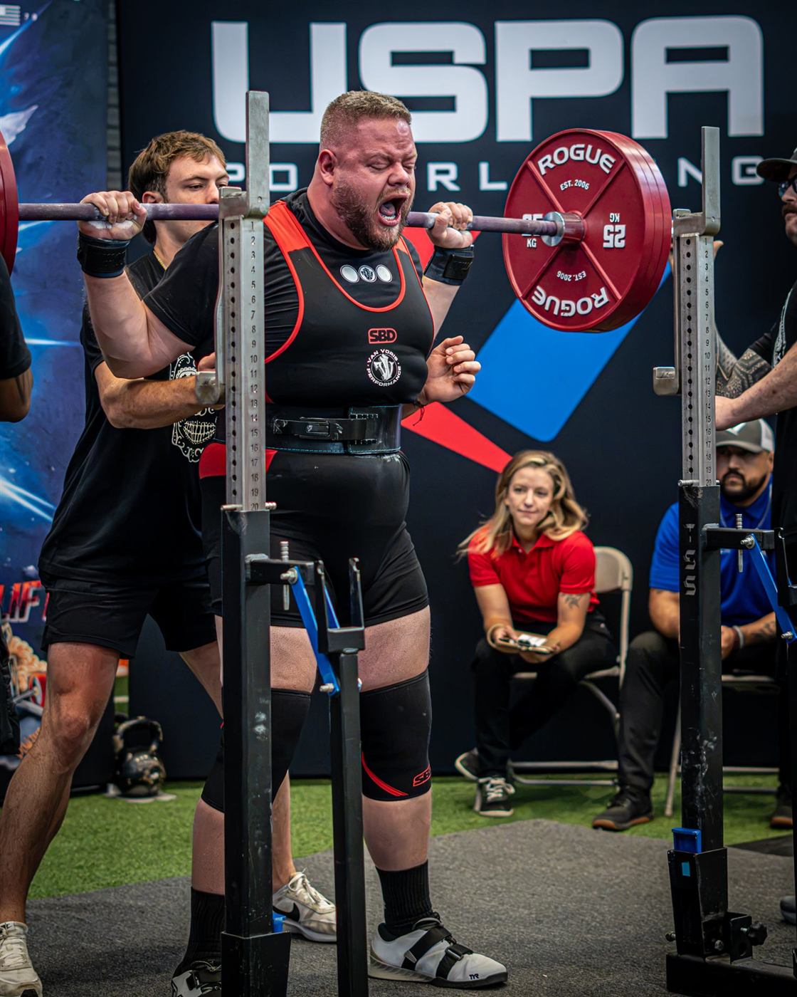 A lifter walking out a heavy squat